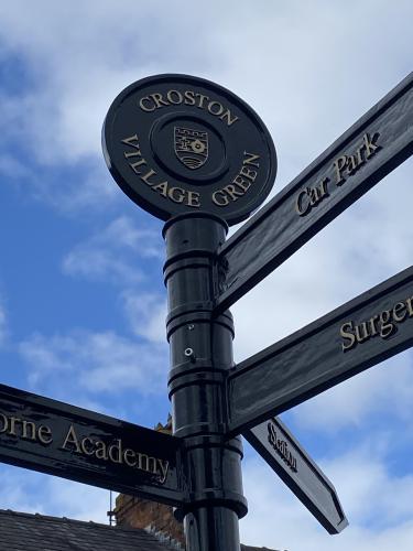 Signpost on The Green AFTER Precept funded renovation August 2024 